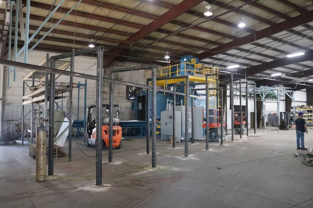 Assembling the additional powder coat line. 