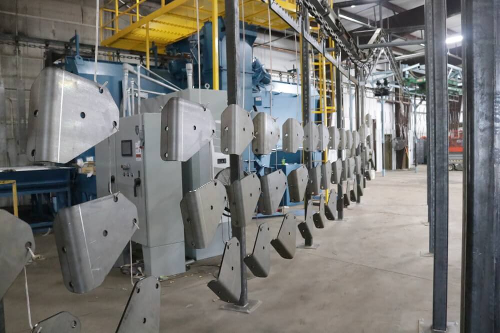 Assembling the additional powder coat line. 