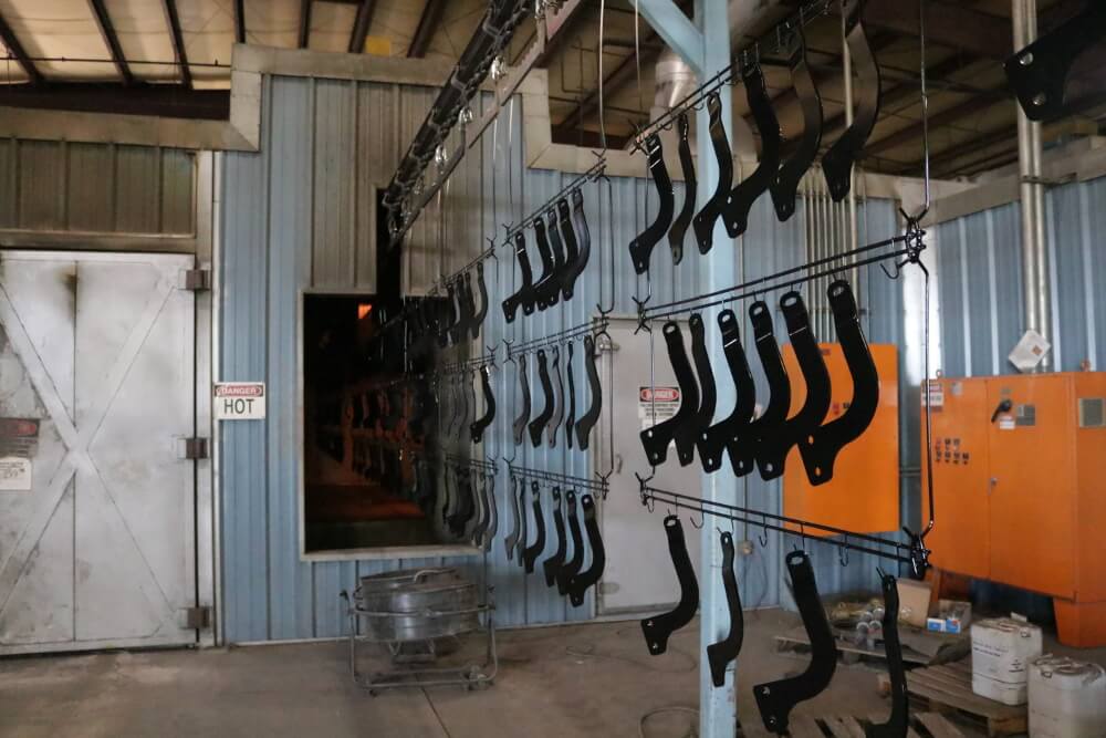 Assembling the additional powder coat line. 
