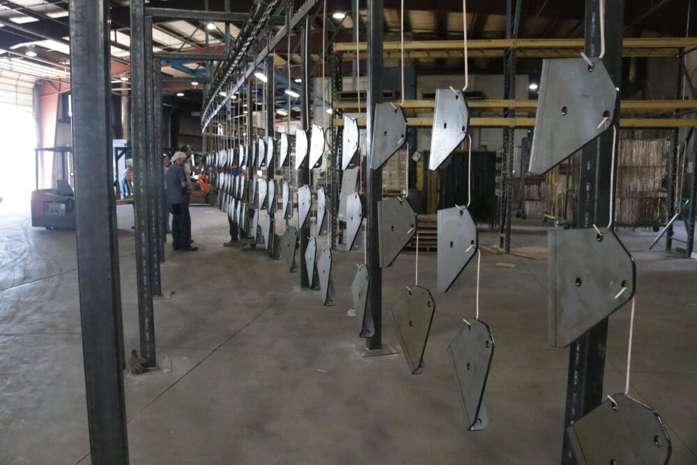 Assembling the additional powder coat line. 