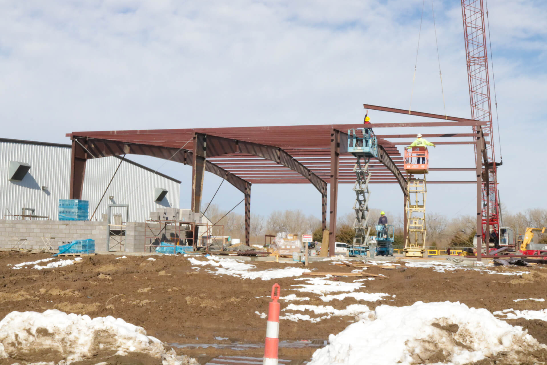Erecting the red iron frame and beams.