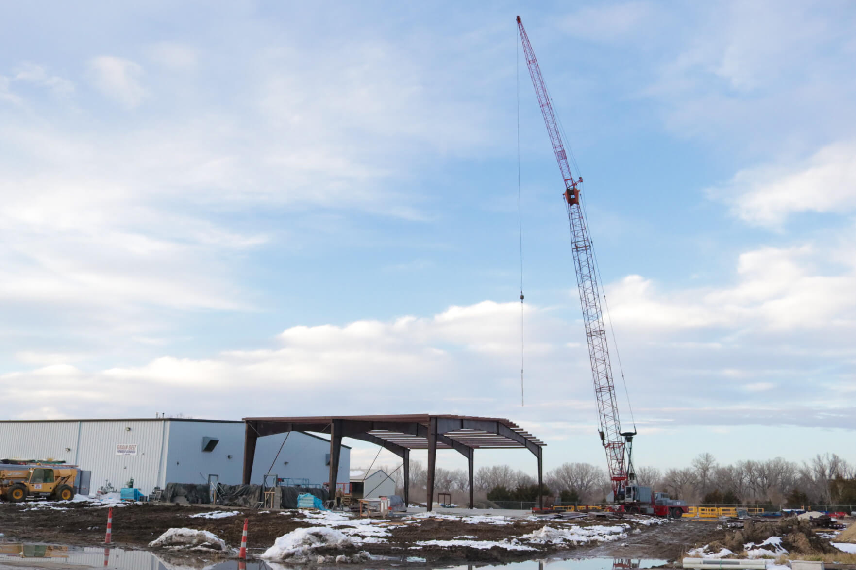Erecting the red iron frame and beams.